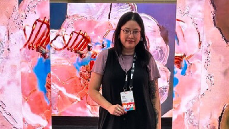 Mae Quach at an Adobe conference